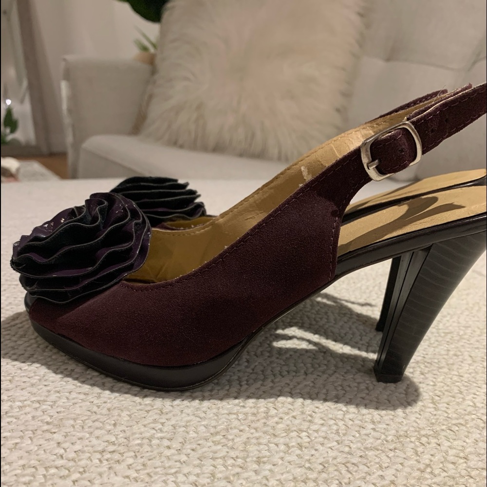 Purple suede platform slingbacks.
